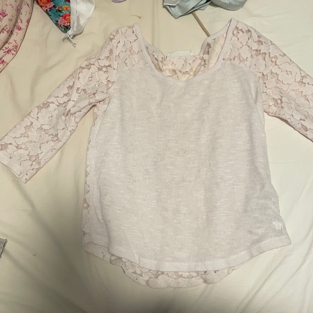 White Abercrombie and fitch shirt. Sleeves are elbow length. Back is laced.